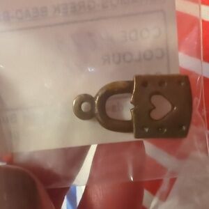 Bronze jewelry charm heart lock for artisan hand crafted work.